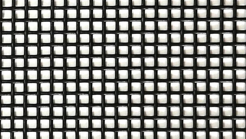 Close-up of 11-11 mesh PVC coated polyester dump truck tarp material showing uniform 51% closed weave pattern