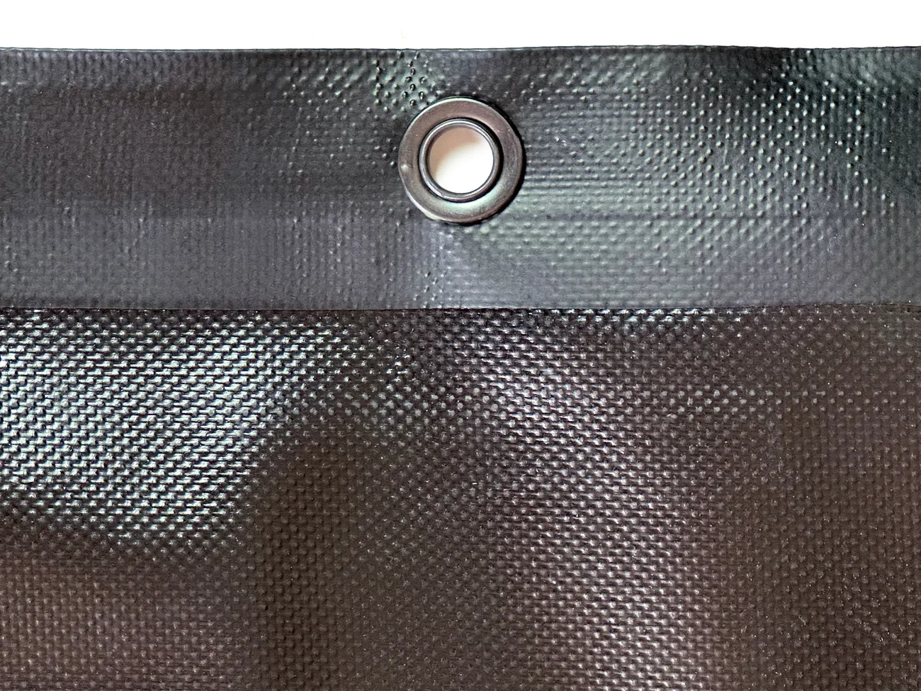 Grommet at the side of a vinyl tarp